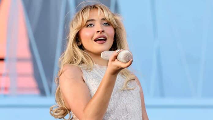 Sabrina Carpenter singing with microphone