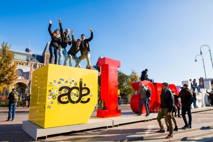 People posing on Amsterdam Dance Event letters