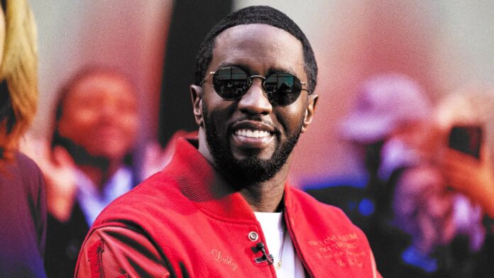 Diddy wearing sunglasses, smiling