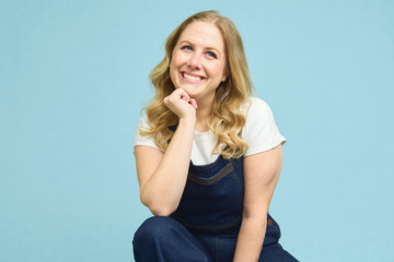 Woman sits cross-legged on floor