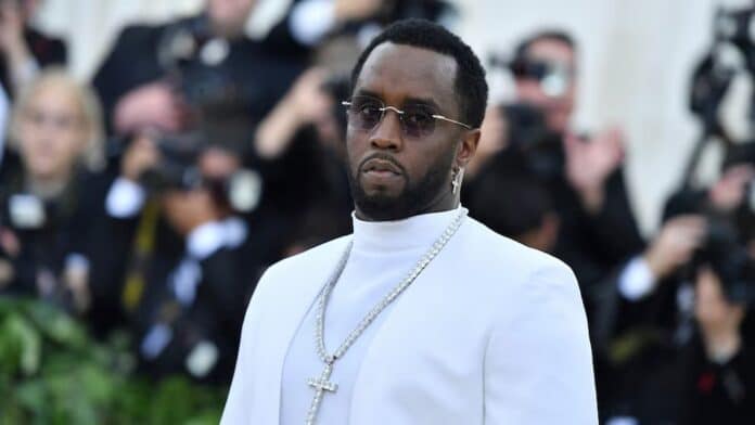 Diddy wearing white suit at hearing