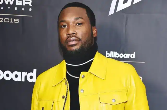 Meek Mill wearing yellow jacket