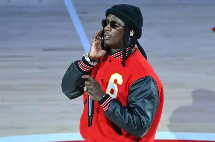 Young Thug wearing red jacket