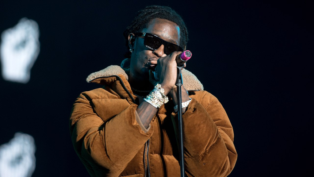 Young Thug holding microphone