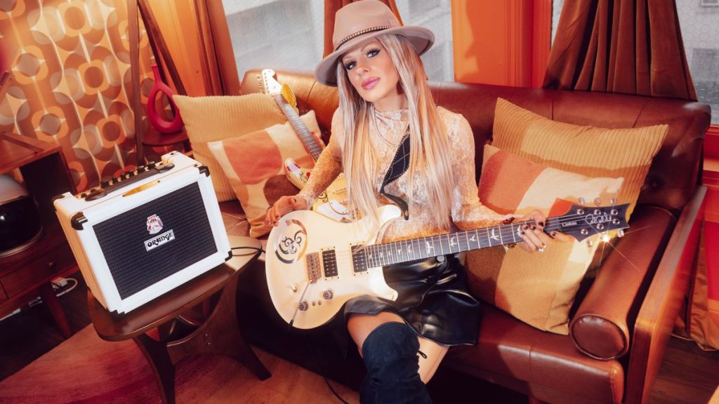 Guitarist Orianthi with Orange amplifier