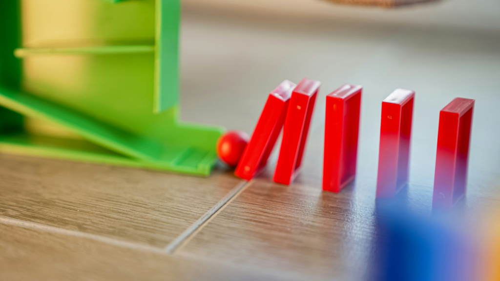 Red dominoes toppling in sequence