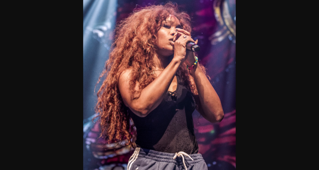 SZA performing live on stage