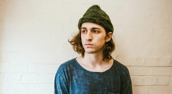 Porter Robinson wearing green beanie