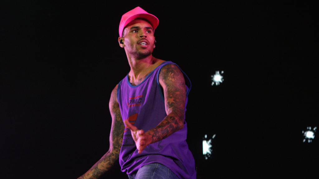 Chris Brown wearing pink baseball cap