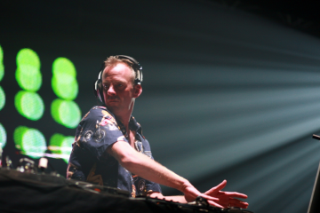 Fatboy Slim DJing with outstretched arm