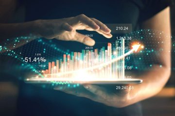 Hand holding tablet with analytics display