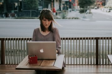 Woman using laptop outdoors