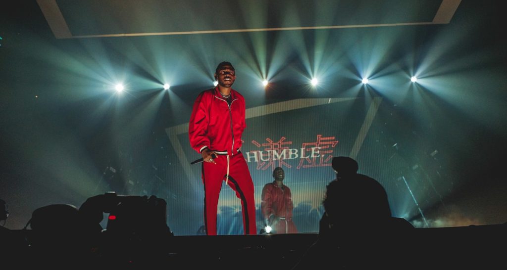 Singer in red outfit on stage