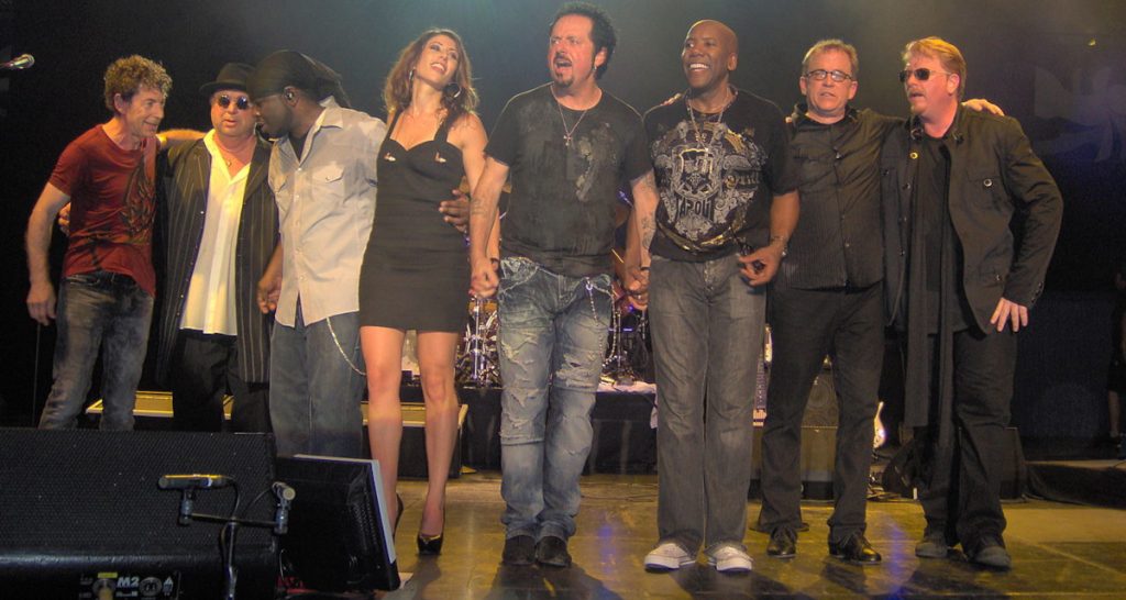 Toto band members performing on stage