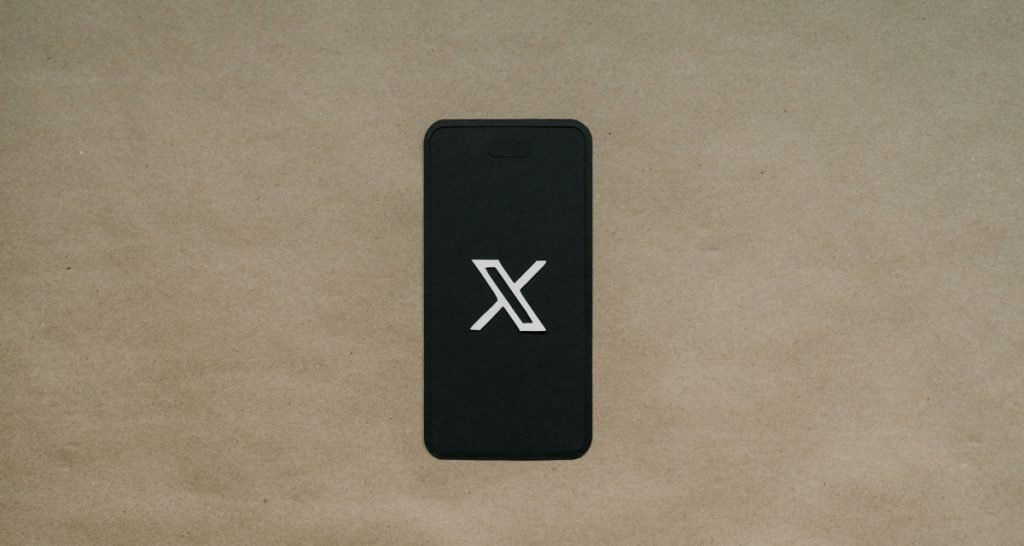 X logo on smartphone screen