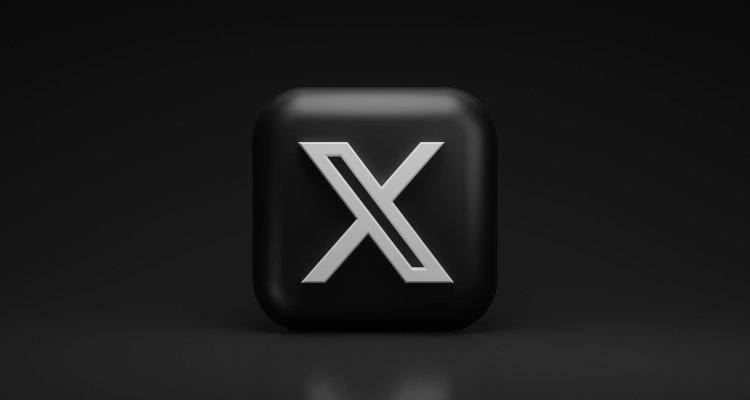 X logo cube on black background