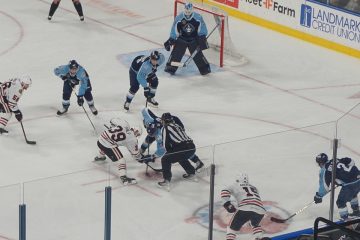 IceHogs hockey players on rink