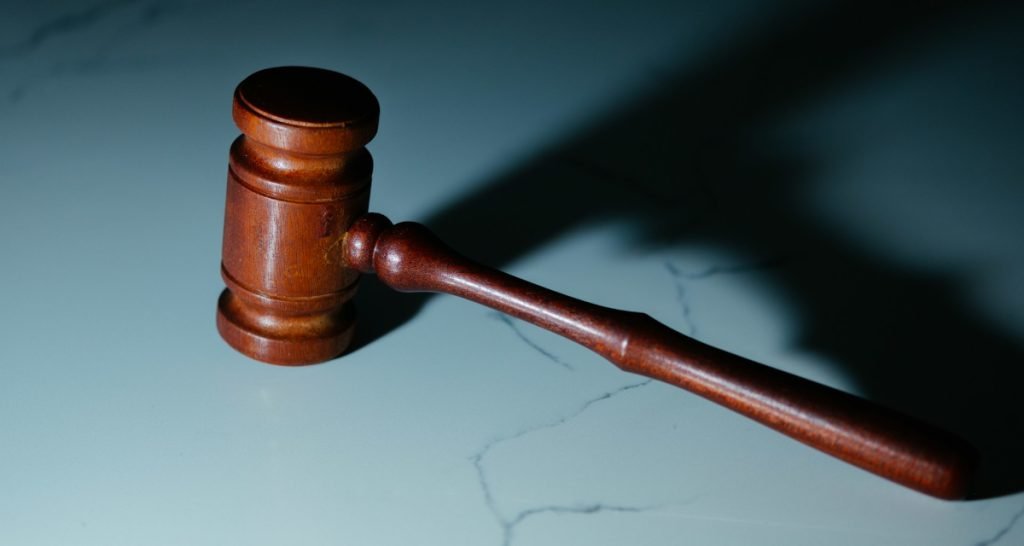 Wooden judge's gavel on table