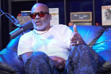 Damon Dash seated on couch