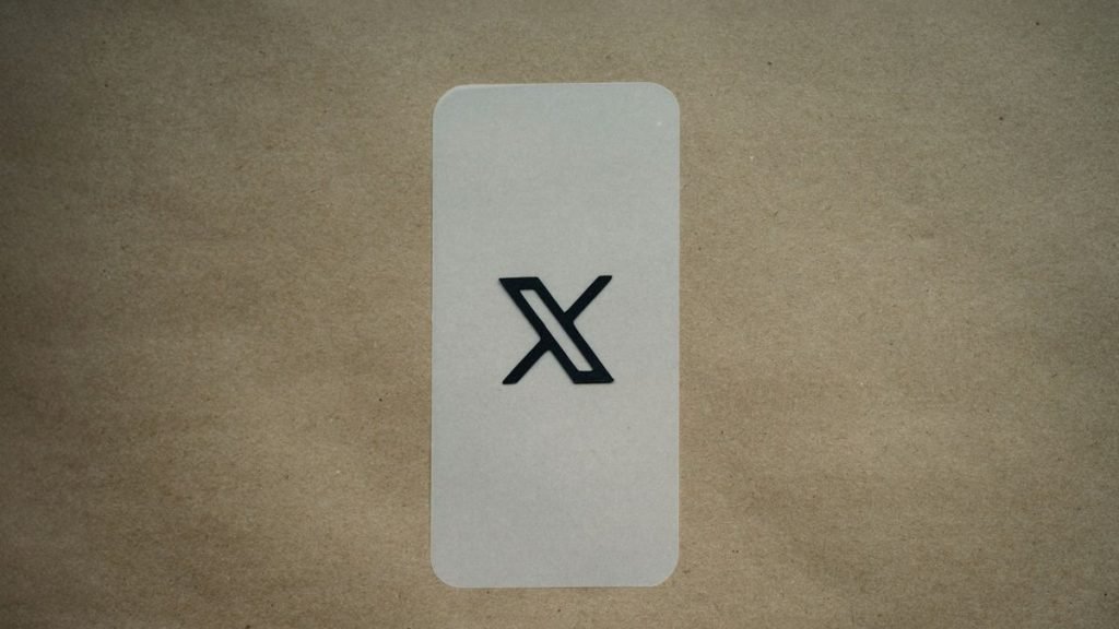 X logo on blue card