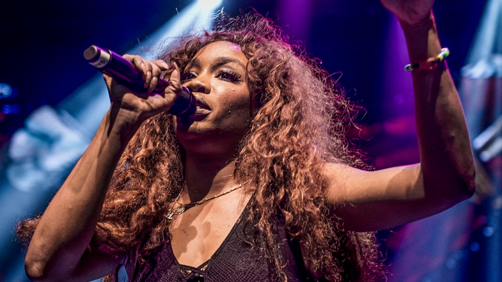 SZA performing live on stage