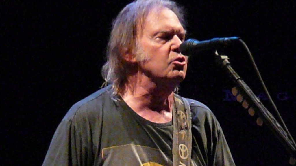 Neil Young singing into microphone