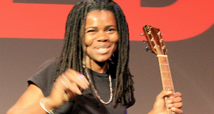 Tracy Chapman performing with acoustic guitar