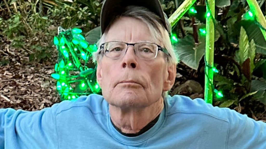 Stephen King with green backdrop