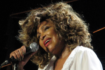 Tina Turner singing on concert stage