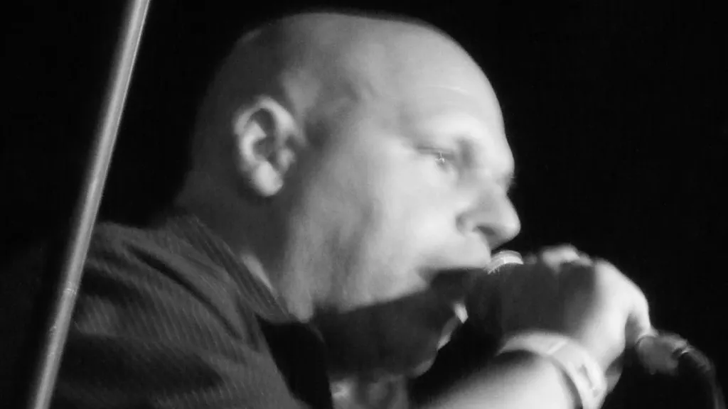 Matt Pinfield singing into microphone