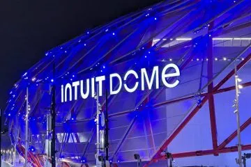 Intuit Dome illuminated at night