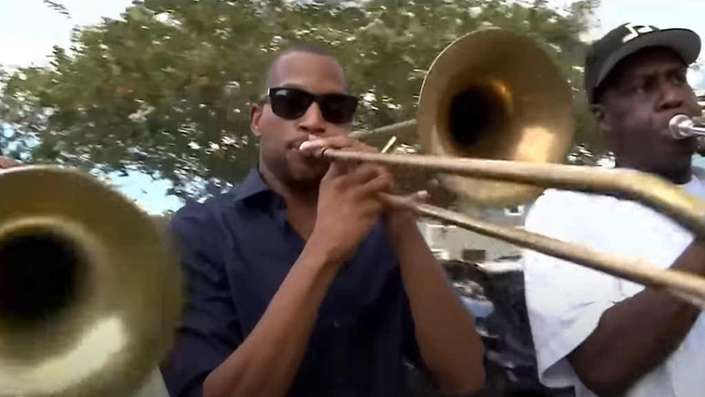 Three trombonists performing in Havana