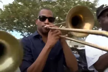 Three trombonists performing in Havana