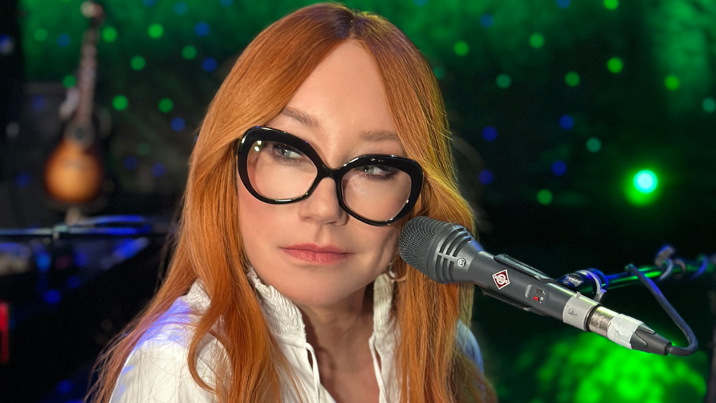 Tori Amos performing at microphone