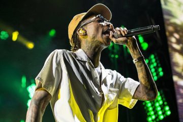 Wiz Khalifa performing with microphone