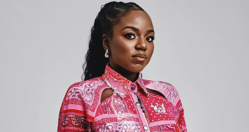 Black woman wearing pink professional attire