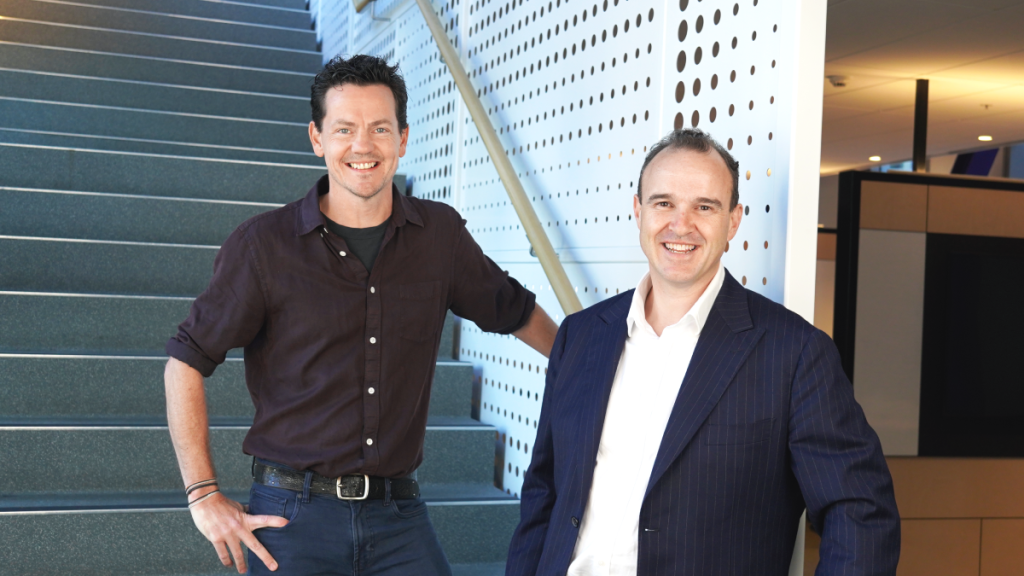 Two executives at office staircase